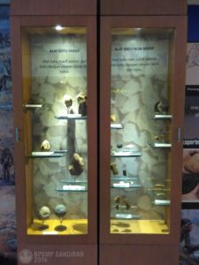 Early man artefacts placed in a glass cabinet